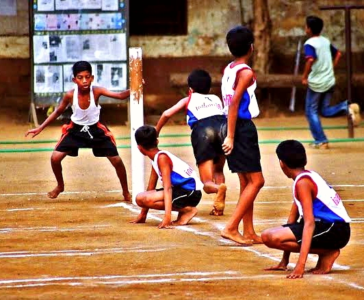 Kids playing Kho kho in the ground - Fall in Sports