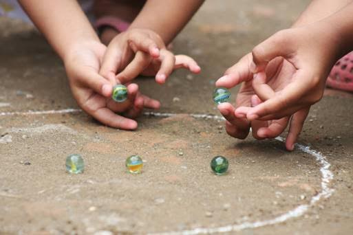 Kids playing Kancha
